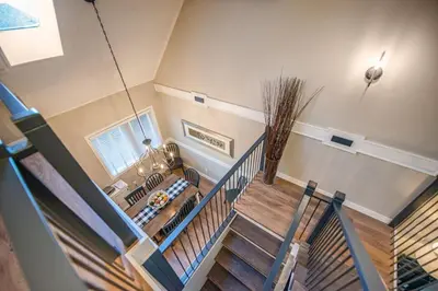 an overhead view of a staircase in a house at 3BR Oasis Private Hot Tub and Sauna Walk to Ski Hill in Kimberley
