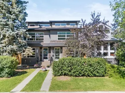 an exterior view of a house with bushes at Calgary Mini Manor Near DT Sleeps 8 Prime Location in Calgary