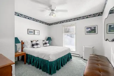 a bedroom with a bed and a ceiling fan at Charming 1BR Near DT Kimberley: Pool, Hot Tub, Gym in Kimberley