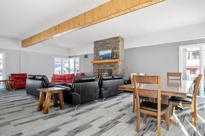 a living room with furniture and a fireplace at Kimberley Escape: 1BR+Studio w/ Hot Tub, Pool, BBQ in Kimberley
