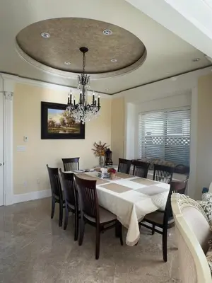 a dining room with a table and chairs and a chandelier at Sweet Graceful Home Queen size bedroom for 2 Guests in Richmond