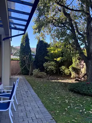 a patio with two chairs and a tree at Sweet Graceful Home Queen size bedroom for 2 Guests in Richmond