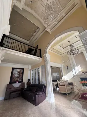 a living room with a couch and a chandelier at Sweet Graceful Home Queen size bedroom for 2 Guests in Richmond
