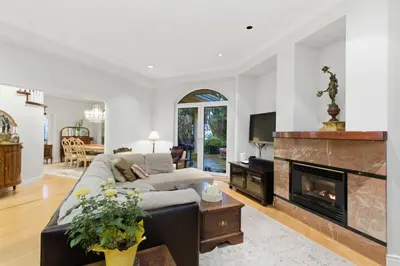 a living room with a couch and a fireplace at Entire Spanish Style Villa 5 Bedrooms near Ocean in West Vancouver
