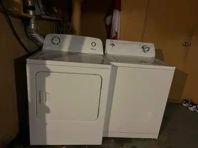 a small white appliance with two boxes on top at Airport Vancouver Private Rooms - Transit at Doorstep, Free Parking & Fast Wi-Fi in Vancouver