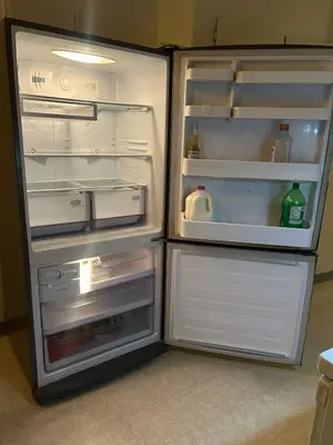 an empty refrigerator with its door open in a kitchen at Airport Vancouver Private Rooms - Transit at Doorstep, Free Parking & Fast Wi-Fi in Vancouver