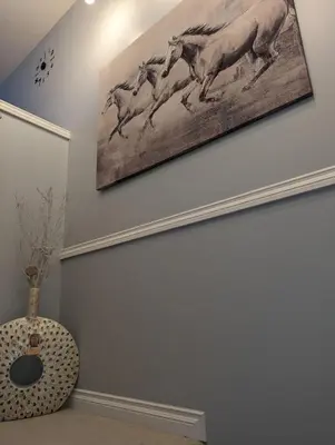 a painting of horses running on a wall at The Love Home Stay in Edmonton