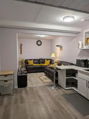 a living room with a couch and a table at The Love Home Stay in Edmonton