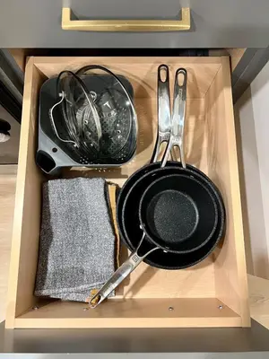 a drawer with a pan and utensils in it at Pet-friendly Walk-Up Condo with Pool & Hot tub! in Canmore