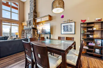 a dining room with a table and chairs at Blackrock 6 in Big White