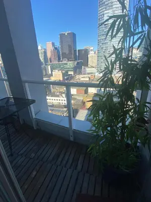 a balcony with a plant and a view of the city at 933 seymour at vancouver downtown in Vancouver