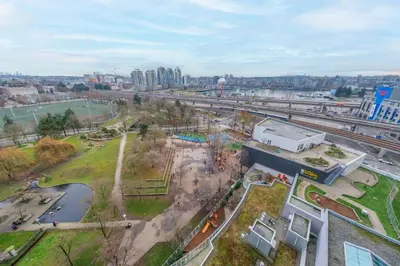 an aerial view of a park with a city at Modern Central Location with Pool Sauna & Jacuzzi in Vancouver