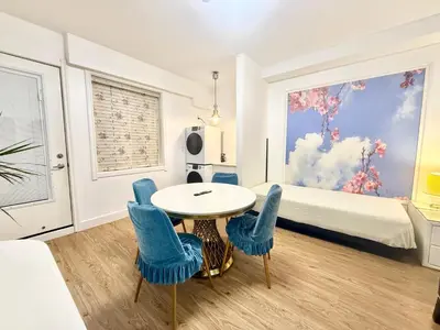 a room with a table and chairs and a bed at Private Guest Suite, One Parking Space in Maple Ridge District Municipality