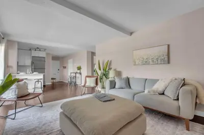 a living room with a couch and a table at 2B 17 Ave King Suite in Calgary