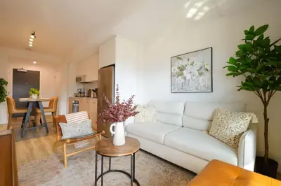 a living room with a white couch and a table at 1506 First and Park in Calgary