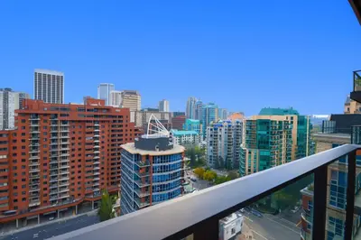 a view of a city skyline with tall buildings at 1506 First and Park in Calgary