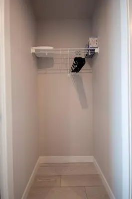 a room with a white wall with a shelf at 418 Frontier in Calgary
