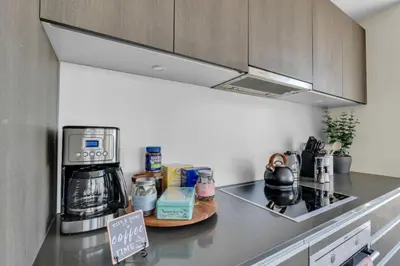 a kitchen with a counter top with a coffeemaker at 1409 Guardian South in Calgary