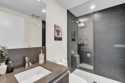 a bathroom with a sink and a shower at 1409 Guardian South in Calgary