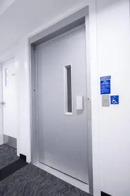 a white door in a building with a sign on it at 431 Frontier in Calgary