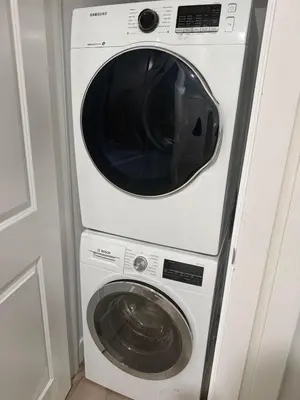 a white washer and dryer in a room at The ideal place for professionals in Prince George