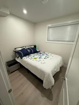 a bedroom with a bed and a window at The ideal place for professionals in Prince George