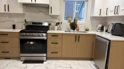 a kitchen with a stove and a sink at Vancouver Downtown Apartment - Walk to SkyTrain & BC Place, Free Parking in Vancouver