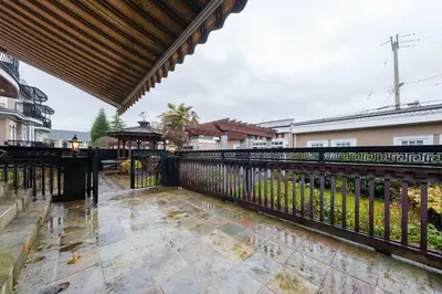 an image of a balcony with a black fence at Luxurious & Spacious Mansion next to Oakridge Mall in Vancouver