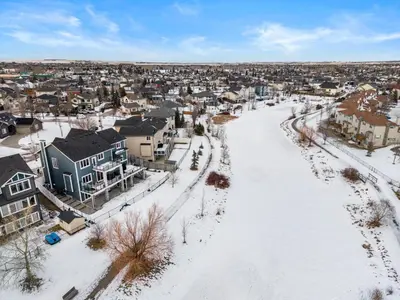 an aerial view of a town in the snow at 1BR Entertainment Space Projector and Games Room in Airdrie