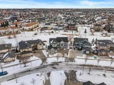 an aerial view of a neighborhood covered in snow at Waterfront 1BR Suite Private and Modern and Queen Bed in Airdrie