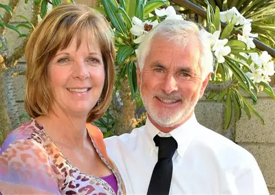 a man and a woman posing for a picture at Retreat Wilderness Inn in Nimpo Lake