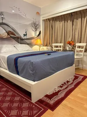 a bedroom with a large bed in a room at private 1br guest suite Vancouver in Vancouver