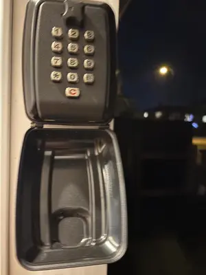 a close up of a cell phone on a door at private 1br guest suite Vancouver in Vancouver