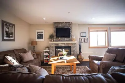 a living room with two couches and a fireplace at Arnica Chalet 2bd 2bath Ski In Out Silver Star in Vernon