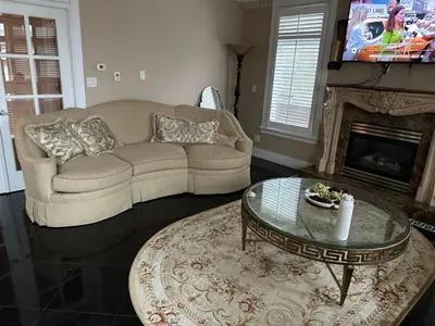 a living room with a couch and a coffee table at Luxury Room with Private Washroom in Prime Location in Vancouver