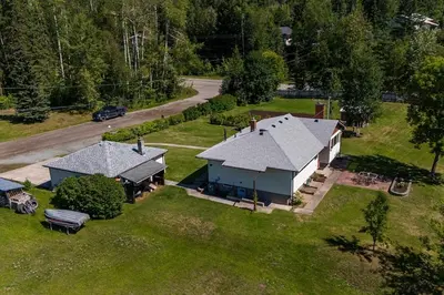 an aerial view of a house on a grass field at The Basement Suite on Paradise Hill in Prince George