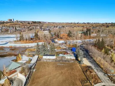 an aerial view of a park with trees and a field at Incredible DT Views| King bed| Rest and Unwind in Calgary
