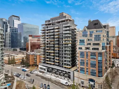 an aerial view of a city with tall buildings at Incredible DT Views| King bed| Rest and Unwind in Calgary