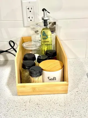 a wooden box with spices and a bottle of soap at Stylish and Cozy 2-Bedroom Guest Suite in West Edmonton in Edmonton