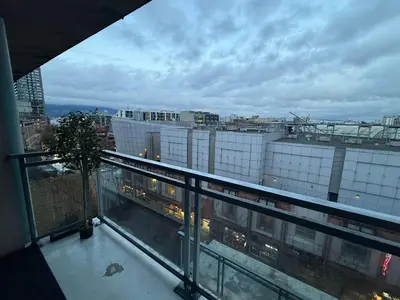 a view of a city from a balcony at Extra Spacious with a King Bed Sauna Pool & Jacuzzi in Vancouver