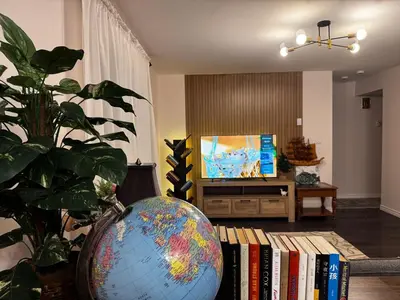 a living room with a globe and a tv at 2BR sweet suite in Nanaimo