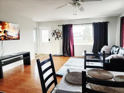a living room with a couch and a table at House in Edmonton
