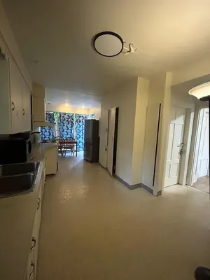 an empty kitchen and living room of a house at Vancouver Airport & UBC Private Rooms - Free Parking, Fast Wifi in Vancouver