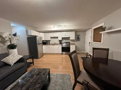 a living room with a couch and a table at 2-Bedroom Private Suite near VIU in Nanaimo