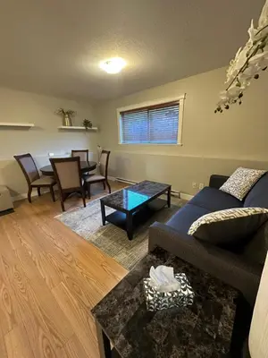 a living room with a couch and a table at 2-Bedroom Private Suite near VIU in Nanaimo