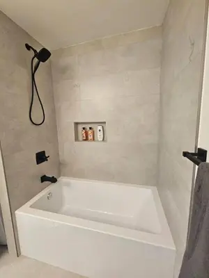 a bathroom with a white bath tub in a room at Comfortable Home Near Hospitals and Parks in Calgary