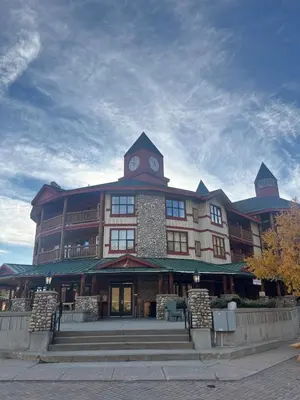 a large building with a clock tower on top of it at Polaris Lodge by StayIn in Kimberley