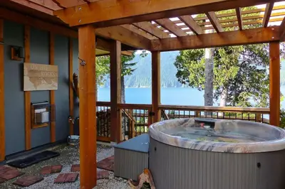 a hot tub in a pavilion with a view of the water at Oceanfront Suite with Hot Tub - No Pets - Sleep 4 in Port Renfrew