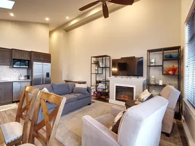a living room with a couch and a fireplace at Amazing Marina & Oceanfront View - Pet Friendly - Sleeps 6 in Port Renfrew