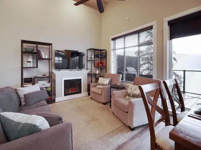 a living room with a couch and a fireplace at Amazing Marina & Oceanfront View - Pet Friendly - Sleeps 6 in Port Renfrew